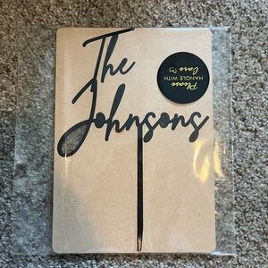 Black “The Johnsons” cake topper